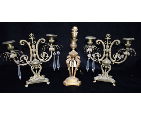 A PAIR OF REGENCY STYLE TWO LIGHT CANDLESTICKS  originally with glass drops, 26cm high; together with an Empire style ormuolu