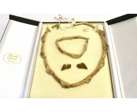 A SILVER THREE PIECE JEWLLERY SET  of textured three colour finish comprising necklace, bracelet and earrings Condition Repor