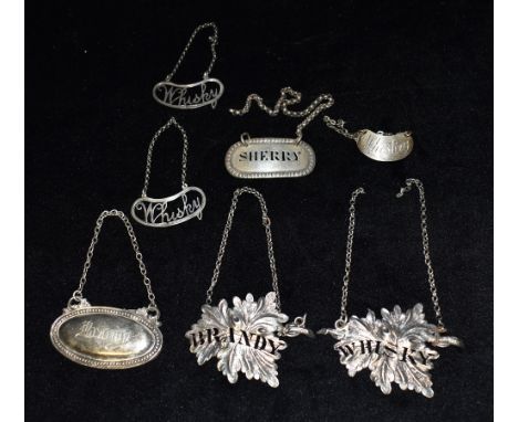 SIX SILVER SPIRIT LABELS comprising a pair of leaf design Brandy &amp; Whisky Birmingham Hallmark for 1838, a pair of openwor