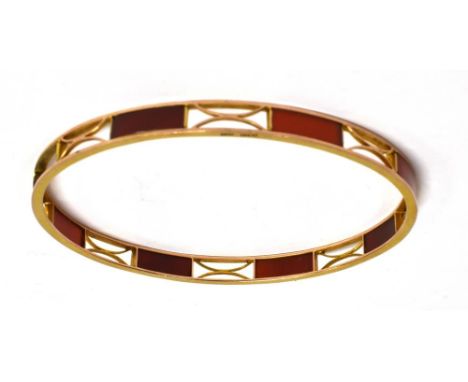 A 9CT ROSE GOLD CORNELIAN SET SLAVE BANGLE  the large round bangle with tablets of cornelian, alternating with wirework panel