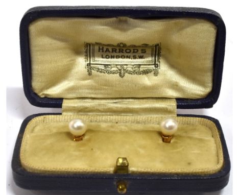 A PAIR OF YELLOW METAL AND PEARL COLLAR STUDS Complete in a Harrods box , yellow metal unmarked assessed as 9ct gold Conditio