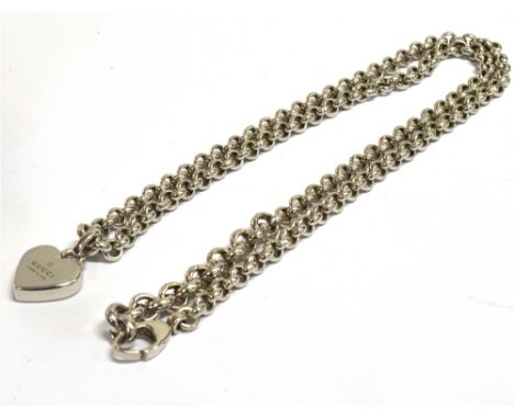 A GUCCI SILVER HEART PENDANT AND CHAIN  The pendant stamped Gucci made in Italy on a silver heavy guage belcher link chain, 2