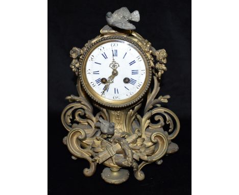 A 19TH CENTURY FRENCH JAPY FILS ROCOCO STYLE GILT METAL MANTLE CLOCK the enamel dial with Roman and Arabic numerals, the 8-da