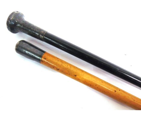 A MALACCA CANE BY BRIGG  with a silver top (London, 1907), engraved 'J.R.', 92cm long; together with an ebonized cane, with a