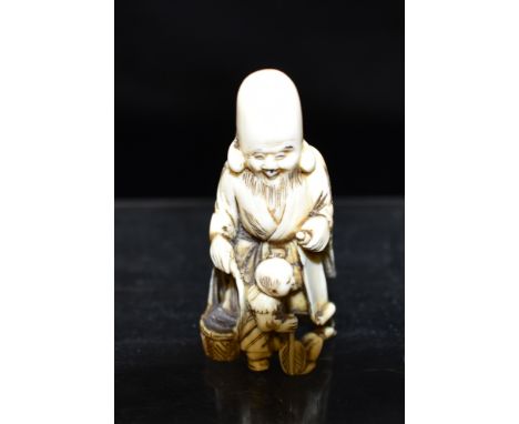 A JAPANESE MEIJI PERIOD CARVED IVORY NETSUKE  finely detailed as Fukurokuju, holding a scroll and basket, 5cm high