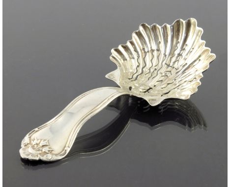 A French silver caddy spoon, Philippe Berthier, Paris 1840s, the pierced and scalloped shell owl with feathered edge, on a Ki