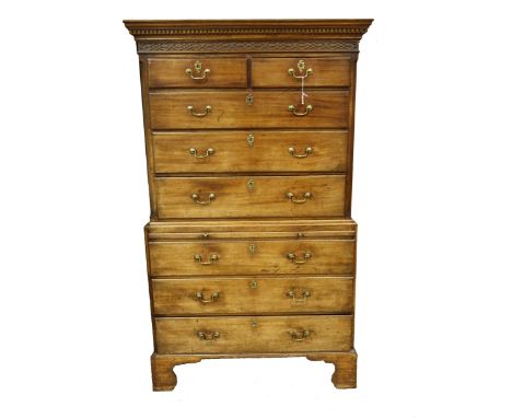 A George III mahogany chest on chest, circa 1810, moulded and dentil cornice, blind fret Chinese Chippendale frieze, two shor