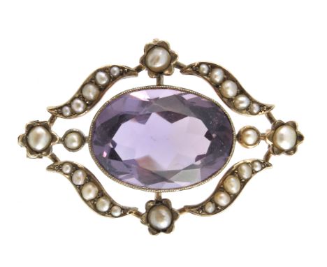 An early 20th century gold, amethyst and split pearl brooch, with floral openwork surround, length 3.3cm, 5.1g, with case