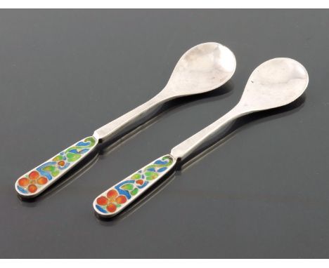 Bernard Instone, a pair of Arts and Crafts silver and enamelled coffee spoons, Birmingham 1927, the champleve enamel terminal