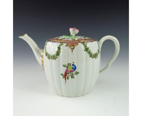 A Worcester polychrome teapot, circa 1775, reeded barrel form painted with exotic birds and hop garlands below tooled gilt C 