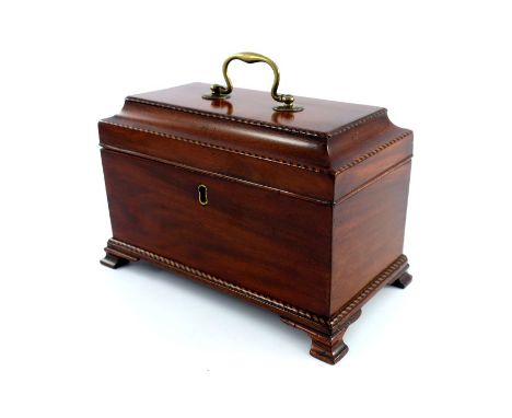 A George III mahogany tea caddy, circa 1790, barbers pole strung throughout with brass swing handle to the caddy top, fitted 