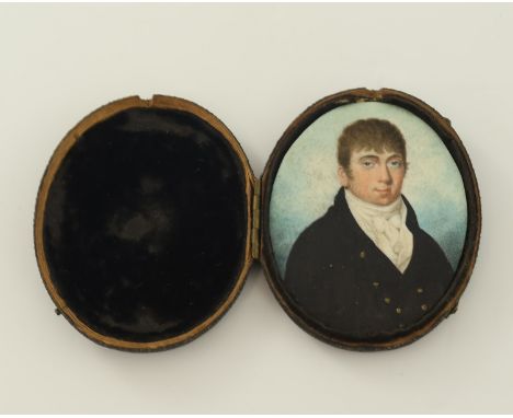 A mid 19th Century oval portrait miniature, circa 1860, young gentleman, bust length wearing a white stock and a black tunic 