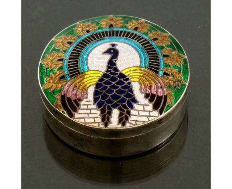 A silver and enamelled box, Oriental, circular form, cloisonne and basse taille decorated with a peacock and acanthus lappets