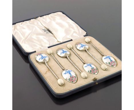 A set of six George VI silver and enamelled coffee bean spoons, Turner and Simpson, Birmingham 1937, each with white bead end