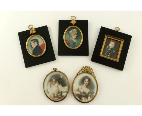 A pair of mid 19th Century oval portrait miniatures on ivory, circa 1860, gentleman and lady companion in bust length profile