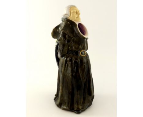 A late 19th Century European majolica pitcher, circa 1880, moulded in the form of a judge, standing wearing a judicial wig an