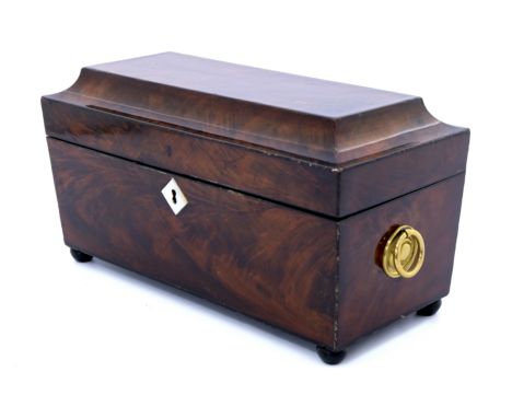 A Regency flame mahogany tea caddy, circa 1820, or sarcophagus form with gilt metal ring handles, mother of pearl escutcheon 