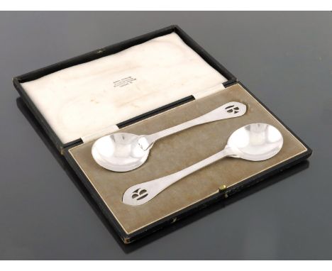 Sibyl Dunlop, a pair of Arts and Crafts silver serving spoons, London 1931, planished form with circular bowls and Celtic poi