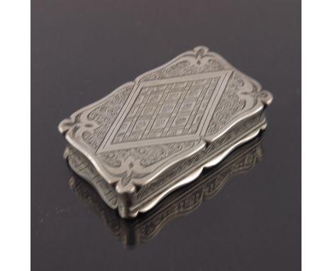 A Victorian silver snuff box, Edward Smith, Birmingham 1861, ogee bordered cuboid form, chased with foliate scroll and geomet