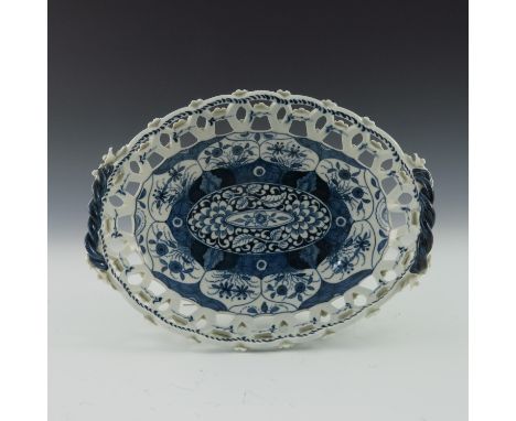 A Worcester blue and white reticulated basket, circa 1775, pseudo Chinese Lingzhi mark, Kangxi pattern, twin handled and stud