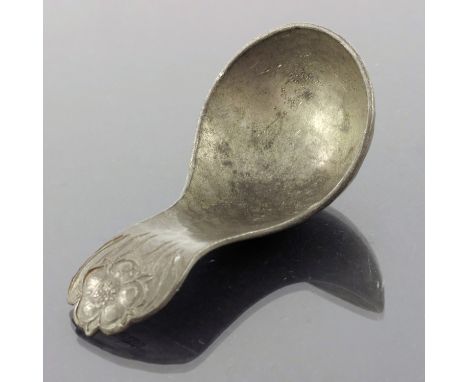 John H Green, an Arts and Crafts pewter caddy spoon, Saffron Walden circa 1925, planished ladle form, the terminal carved wit