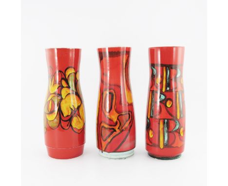 Three Poole Pottery Delphis vases, various artists circa 1960s, shouldered chimney form, printed and painted marks, 39.5cm hi