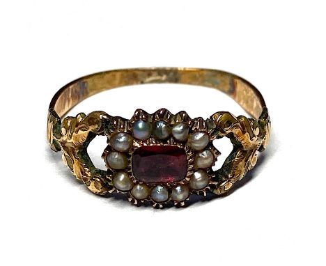 A late Georgian gold, garnet and split pearl cluster dress ring, with foliate engraved shoulders and grooved band, ring size 