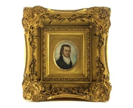 British School, mid 19th Century, an oval portrait miniature, young gentleman, bust length wearing a white stock and a black 