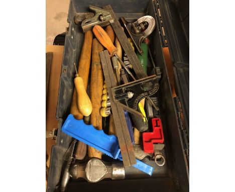 Various woodworking hand tools in a toolbox