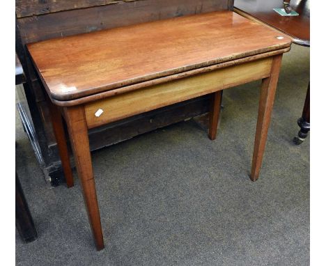 A George III Mahogany Foldover Tea Table, 91cm by 45cm by 74cmSome light marks and fading to the top, internally with repairs