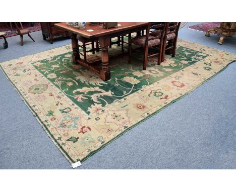 Egyptian Ziegler Carpet, the field with large palmettes and meandering vines framed by similar borders, flanked by guard stri