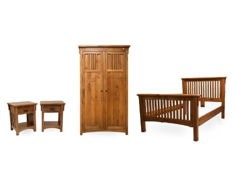 A Modern Oak Four Piece Bedroom Suite, comprising: a double wardrobe, double bedstead and a pair of bedside tables (4)