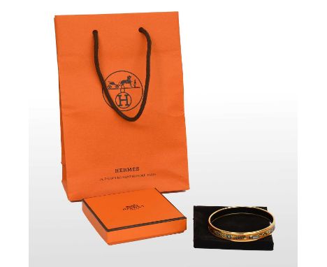 Hermès Enamel Bangle printed in orange and decorated with scent bottles, velvet pouch, original box, ribbon and bag, 7cm diam