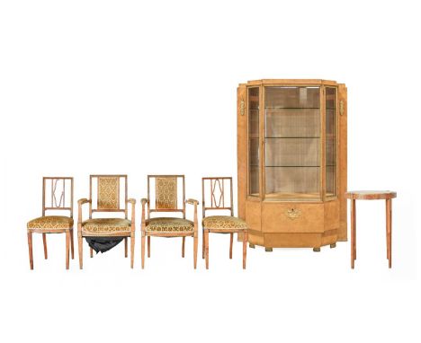 A German Secessionist Sycamore Maple Salon Suite, circa 1900, comprising a vitrine, stepped breakfront with applied gilded mo