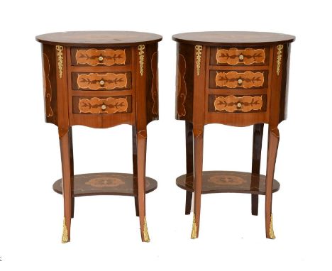 A Pair of French Reproduction Inlaid Walnut Gilt Metal Mounted Bedside Chests of Drawers, each with oval top over three short