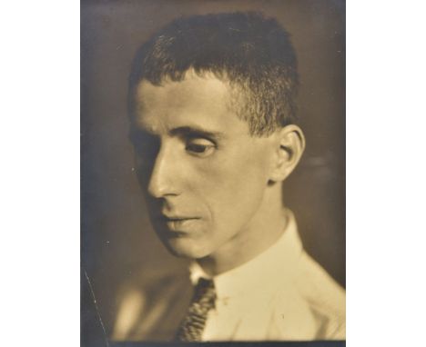 *Osborne (Li, 1883-1968, attrib.). Portrait of a young Bertolt Brecht, c. 1926,  bromide print, head and shoulders in half pr