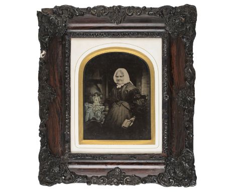 *Oversize half-plate ambrotypes of husband, wife and mother or mother-in-law, 1859,  some tinting and gilt highlights, the hu