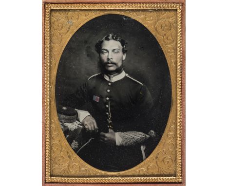 *Quarter-plate ambrotype portrait of a regimental sergeant major in the 17th Light Dragoon Lancers, c. 1860,  seated at a tab