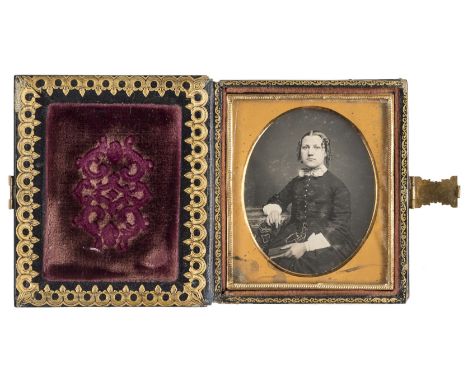 *Two sixth-plate daguerreotypes of seated ladies by an unknown photographer, late 1850s,  housed in a mother-of-pearl inlaid 