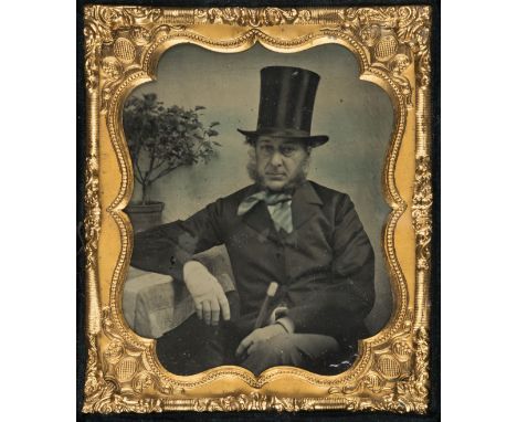 *Sixth-plate ambrotype portrait of a seated gentleman with a top hat, by F. Reynolds Photographic Gallery, Leamington, late 1