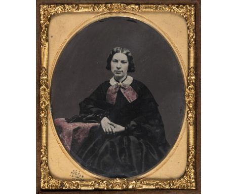 *Sixth-plate tinted ambrotype of a woman, by E. Eccles, artist, Agur Street, Bury, [Lancashire], 1860s,  gilt highlights, the