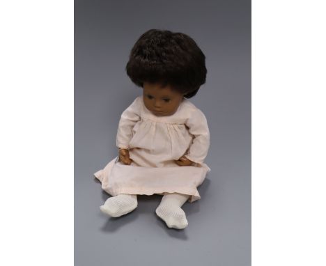 A vintage Sasha baby doll, with original metal tag on wrist, excellent condition