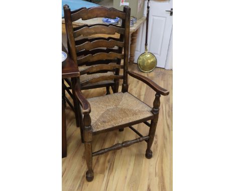 A set of six ash rush seated ladder back dining chairs (one arm with arms)