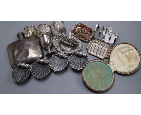 A set of late Victorian silver shell salts and other items including silver toastracks, silver napkin rings, silver hip flask