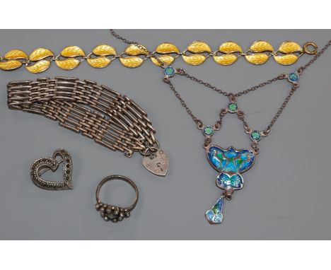 A small group of jewellery including silver and white metal and enamel.