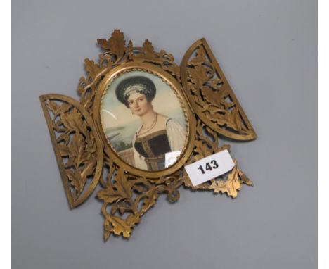 An ormolu framed printed portrait miniature of a Greek woman, brass frame