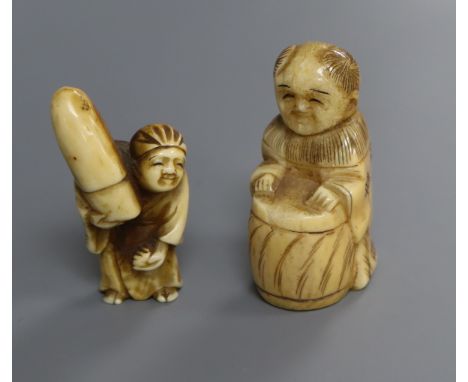 A Japanese ivory netsuke of a walrus and another of a man