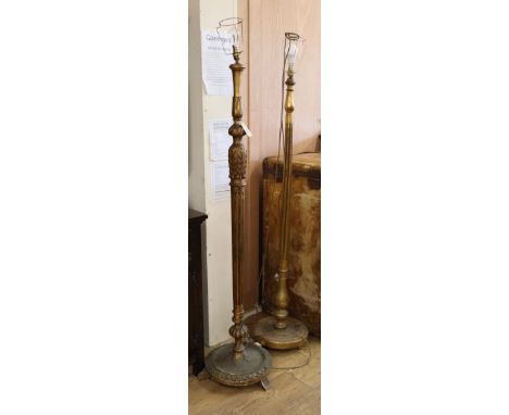 Two carved giltwood lamp standards H.173cm and 170cm approx.