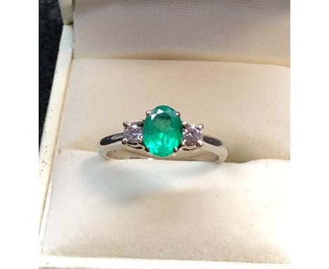 Platinum Emerald and Diamond ring hallmarked 950 set with central Emerald measures approx 8mm by 6.5mm with diamond each side