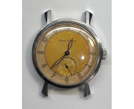 Vintage Jaeger lecoultre gents wrist watch stainless steel case watch winds and ticks but no warranty given no lugs or strap 
